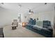 Large bonus room with neutral carpet, ample seating, and a view from the window at 3648 Praed Pl, Fuquay Varina, NC 27526