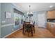 Cozy dining area with hardwood floors and natural light, adjacent to kitchen at 3648 Praed Pl, Fuquay Varina, NC 27526