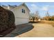 Attached two-car garage with extended driveway and mature landscaping adds charm and convenience to this home at 3648 Praed Pl, Fuquay Varina, NC 27526