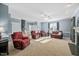 Spacious living room with a fireplace, carpet, and neutral color palette at 3648 Praed Pl, Fuquay Varina, NC 27526
