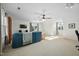 Spacious living area with a comfortable sofa and several sunny windows with peaceful views at 3648 Praed Pl, Fuquay Varina, NC 27526