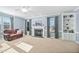 Comfortable living room with fireplace, carpet flooring, and natural light at 3648 Praed Pl, Fuquay Varina, NC 27526