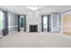 Spacious living room featuring a fireplace with decorative tile surround and built-in shelving at 3648 Praed Pl, Fuquay Varina, NC 27526