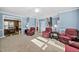 Open living room leading to dining area and foyer with staircase at 3648 Praed Pl, Fuquay Varina, NC 27526