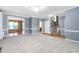Bright living room with neutral walls and plush carpeting, complemented by staircase and white trim at 3648 Praed Pl, Fuquay Varina, NC 27526