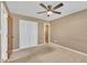 Neutral bedroom featuring a ceiling fan, closet, and neutral walls at 43 Old Halifax Rd, Louisburg, NC 27549