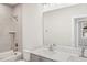 Bathroom featuring a tub-shower combination with modern fixtures and a double sink vanity at 4501 Mint Leaf Ln, Raleigh, NC 27612