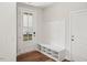 Mudroom area with bench and coat rack with a glass door at 4501 Mint Leaf Ln, Raleigh, NC 27612