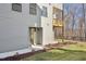 Side exterior of home with a small balcony, landscaping and secondary entrance at 4501 Mint Leaf Ln, Raleigh, NC 27612
