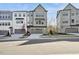 View of new townhomes with attached garages, modern design and professionally landscaped at 4501 Mint Leaf Ln, Raleigh, NC 27612