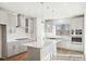 Kitchen featuring stainless steel appliances, custom cabinets, and center island at 4501 Mint Leaf Ln, Raleigh, NC 27612