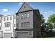 New construction with gray siding, black trim, and attached garage at 4506 Mint Leaf Ln, Raleigh, NC 27612