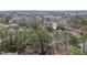 Aerial view of the neighborhood with mature trees, and the property's location pin-pointed at 4523 Hamptonshire Dr, Raleigh, NC 27613