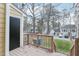 View from the back deck shows the lawn, mature trees, and other residences at 4523 Hamptonshire Dr, Raleigh, NC 27613