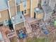 Aerial view of backyard featuring a wooden deck, fenced-in yard, and mature trees at 4523 Hamptonshire Dr, Raleigh, NC 27613