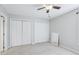 Neutral bedroom with two large closets, bright window and carpet flooring at 4523 Hamptonshire Dr, Raleigh, NC 27613