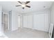 Neutral bedroom with two large closets, bright window and carpet leading to hallway at 4523 Hamptonshire Dr, Raleigh, NC 27613