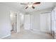 Neutral bedroom with access to bath, hallway and closet space, carpeted flooring and ceiling fan at 4523 Hamptonshire Dr, Raleigh, NC 27613