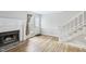 Inviting living room boasting hardwood floors, stairs, a fireplace, and access to the home's front entrance at 4523 Hamptonshire Dr, Raleigh, NC 27613