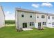 Expansive backyard features a well-maintained lawn, small patios, and greenery, creating a serene outdoor space at 46 Shay St, Angier, NC 27501