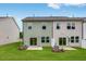 Private backyard with healthy green lawn and concrete patio and low landscaping that creates curb appeal at 46 Shay St, Angier, NC 27501