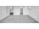 Spacious carpeted bedroom leading to a bathroom with tile flooring at 46 Shay St, Angier, NC 27501