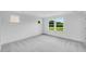 Spacious bedroom with plush carpet, large windows and neutral paint at 46 Shay St, Angier, NC 27501