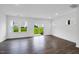 Bright living room with hardwood floors and sliding glass door leading to the patio at 46 Shay St, Angier, NC 27501