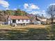 Expansive backyard features an outdoor lounge, patio, and large lawn at 47 Angela Way, Durham, NC 27703