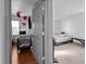 View from doorway into bedroom featuring a bed and furniture across carpeted floor at 47 Angela Way, Durham, NC 27703