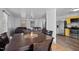 Dining area leading to the living room and open concept kitchen with stainless steel appliances at 47 Angela Way, Durham, NC 27703