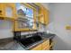Close up of a bright kitchen sink with a view of the outdoors at 47 Angela Way, Durham, NC 27703