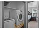 This laundry closet features modern machines and is attached to a bedroom at 47 Angela Way, Durham, NC 27703