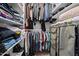Organized walk-in closet offers ample storage space for your wardrobe at 47 Angela Way, Durham, NC 27703