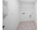 Laundry room with tile floor and hookups at 52 Shay St, Angier, NC 27501