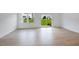 The light filled living room has vinyl flooring and access to the backyard at 52 Shay St, Angier, NC 27501