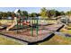 Playground features a variety of slides and climbing structures, surrounded by a wood chip safety surface at 52 Shay St, Angier, NC 27501