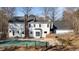 This backyard features a brick chimney and a pool that is partially covered, with some trees at 5317 Chimney Swift Dr, Wake Forest, NC 27587