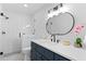 Bright bathroom featuring a modern vanity, updated shower, and stylish accents at 5317 Chimney Swift Dr, Wake Forest, NC 27587