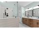 Well-designed bathroom with a glass shower and a spacious double vanity at 5317 Chimney Swift Dr, Wake Forest, NC 27587