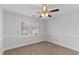 A well-lit bedroom featuring a ceiling fan and neutral carpeting at 5317 Chimney Swift Dr, Wake Forest, NC 27587