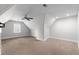 This carpeted bonus room is a large, open space with recessed lighting and natural light from a single window at 5317 Chimney Swift Dr, Wake Forest, NC 27587