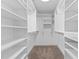 Spacious walk-in closet with custom shelving and ample storage space at 5317 Chimney Swift Dr, Wake Forest, NC 27587