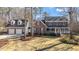 Traditional brick home with blue shutters, white trim, a lush green lawn, and an attached two car garage at 5317 Chimney Swift Dr, Wake Forest, NC 27587