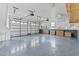 This garage is empty and clean, with a light gray floor and two garage doors at 5317 Chimney Swift Dr, Wake Forest, NC 27587