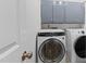 Well-equipped laundry room with modern washer, dryer, and storage cabinets at 5317 Chimney Swift Dr, Wake Forest, NC 27587