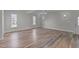 Spacious living room featuring hardwood floors, neutral walls, recessed lighting, and a ceiling fan at 5317 Chimney Swift Dr, Wake Forest, NC 27587
