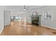 Open concept living room featuring fireplace, windows, and hardwood floors at 5317 Chimney Swift Dr, Wake Forest, NC 27587