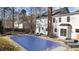 This backyard pool is surrounded by lounge chairs and a table. There is a white brick home in the background at 5317 Chimney Swift Dr, Wake Forest, NC 27587