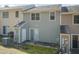 Back exterior view shows siding, a patio, and easy backyard access at 535 Darby Glen Ln, Durham, NC 27713